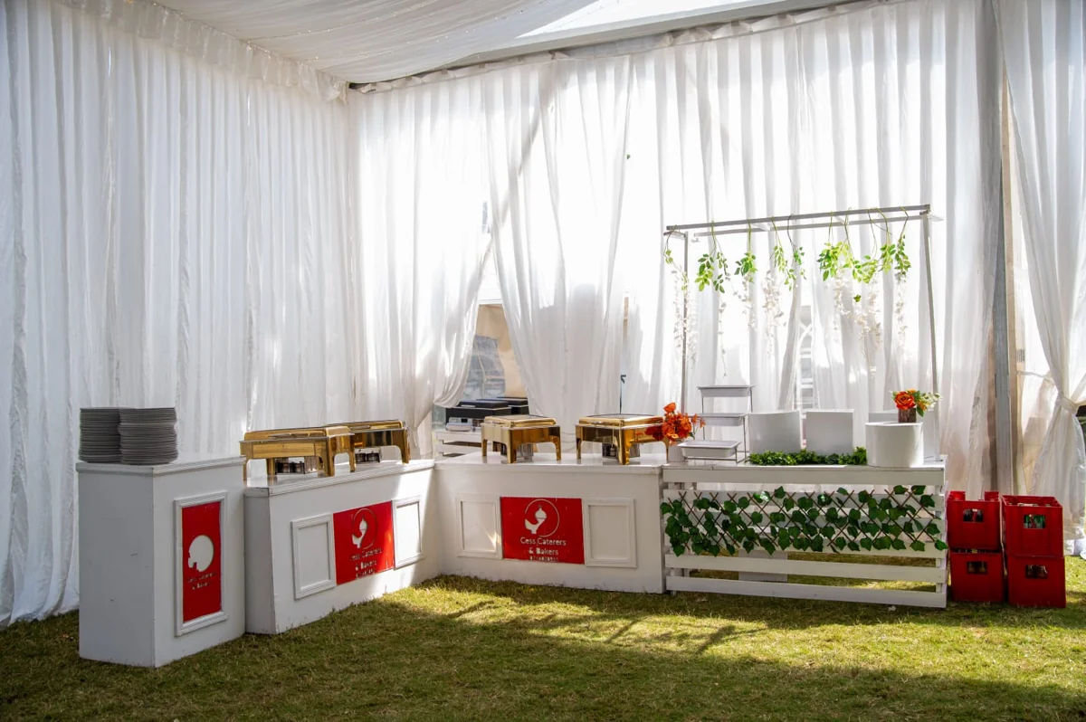 Buffet setup beneath a white marquee