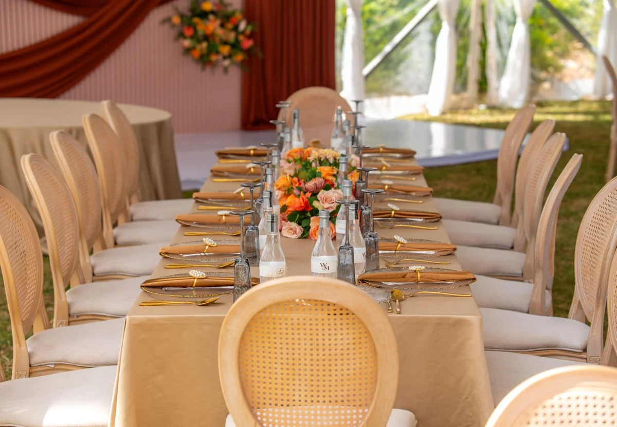 Floral table setting beneath a marquee at a Bonsai event