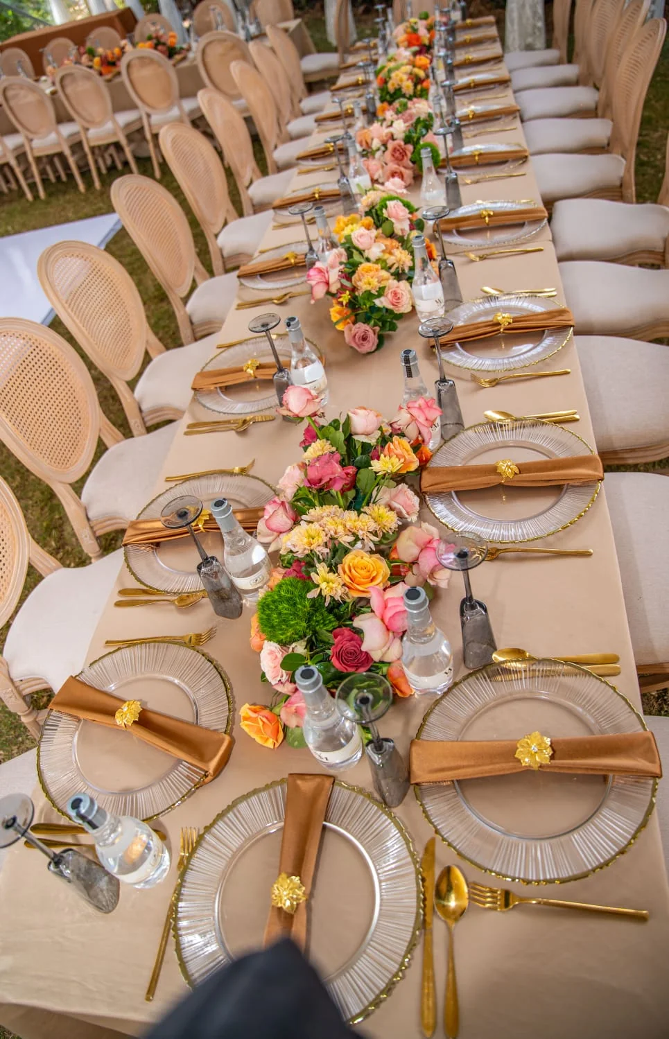 Flower-lined dining table prepared for a celebration